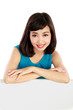 smiling young woman showing blank signboard