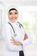 smiling asian medical doctor in scarf
