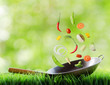 Fresh vegetables are falling in wok. Concept of cooking
