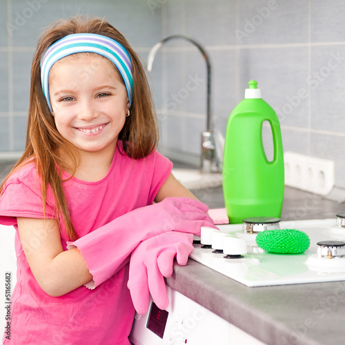 Photo: girl make cleaning in the kitchen girl make cleaning in the kitchen