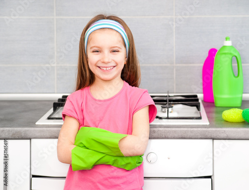 Photo: girl make cleaning in the kitchen girl make cleaning in the kitchen