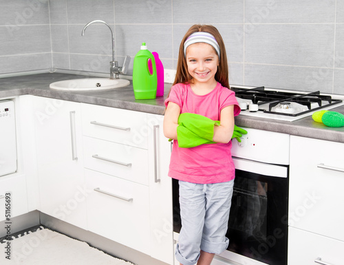 Photo: girl make cleaning in the kitchen girl make cleaning in the kitchen