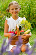 Vegetable garden - lovely girl with basket of vegetables