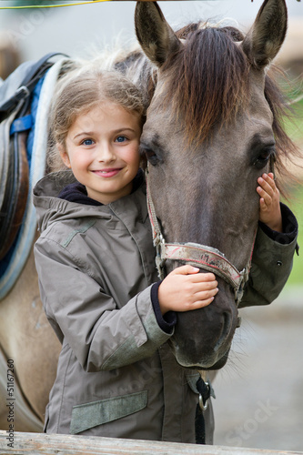 Photo: Horse and lovely equestrian girl Horse and lovely equestrian girl