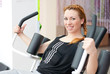 Cute young happy smiling woman doing fitness exercesing