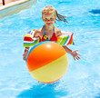 Child on water slide at aquapark.