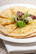 garlic pita bread pizza with salad on top