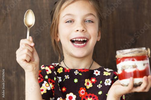 Photo: Child eating dessert Child eating dessert