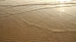 Sea wave over sand
