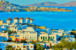 Greece Mykonos, windmills view with buildings and sea for backgr