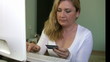 Woman confirming credit card data for e-commerce.