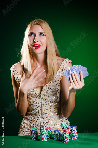 Photo: Woman in casino playing cards Woman in casino playing cards