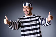 Convict criminal in striped uniform