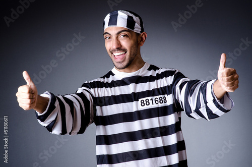 Photo: Convict criminal in striped uniform Convict criminal in striped uniform