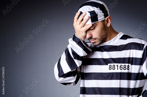 Photo: Convict criminal in striped uniform Convict criminal in striped uniform