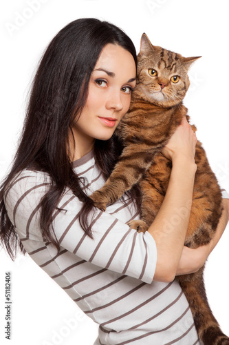 Photo: beautiful smiling brunette girl and her ginger cat over white ba beautiful smiling brunette girl and her ginger cat over white ba