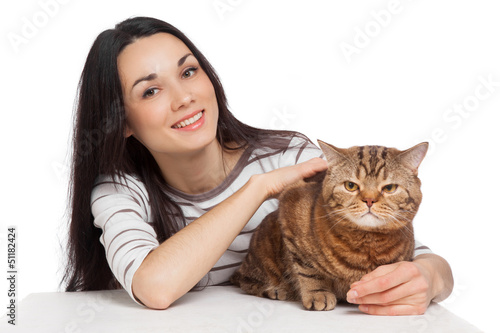 Photo: beautiful smiling brunette girl and her ginger cat over white ba beautiful smiling brunette girl and her ginger cat over white ba