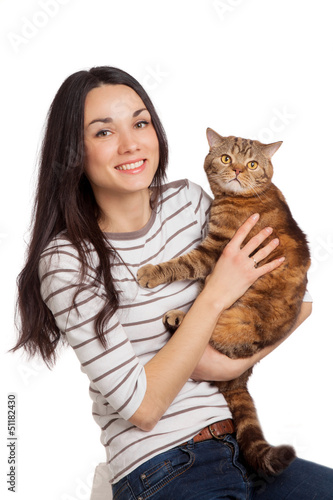 Photo: beautiful smiling brunette girl and her ginger cat over white ba beautiful smiling brunette girl and her ginger cat over white ba