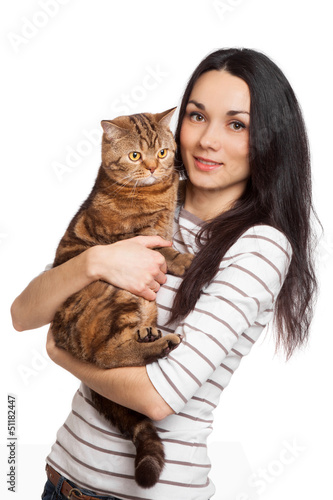 Photo: beautiful smiling brunette girl and her ginger cat over white ba beautiful smiling brunette girl and her ginger cat over white ba