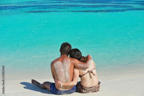Photo: happy young couple enjoying summer on beach happy young couple enjoying summer on beach