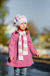 Young girl standing at walkway