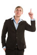 A confident young businessman pointing upwards while isolated on