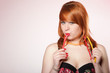 happy redhair woman with gummy candy