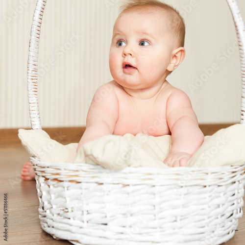 Photo: baby girl in basket baby girl in basket