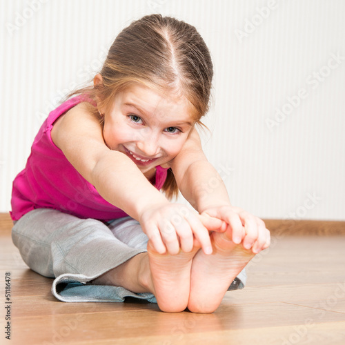 Photo: little girl engaged in fitness little girl engaged in fitness