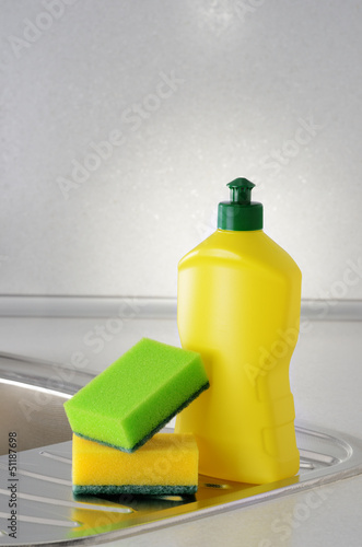 Photo: Dishwashing liquid with a sponge on kitchen sink Dishwashing liquid with a sponge on kitchen sink
