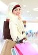 young muslim woman with shopping bag
