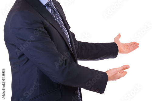 Photo: Business man with welcoming gesture. Business man with welcoming gesture.