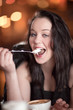 Photo: Young woman enjoying dessert Young woman enjoying dessert