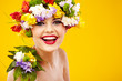 The attractive girl, front portrait, on a head a flower wreath