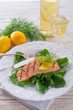grilled salmon fillets on spinach