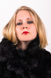 saucy young attractive woman in a black fur