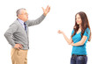 An angry father reprimanding his daughter