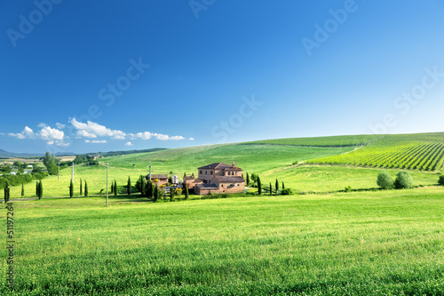 Photo: Tuscany landscape with typical farm house, Italty Tuscany landscape with typical farm house, Italty