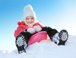 Girl with sleds on the hill