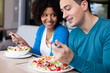Lovely interracial couple having lunch