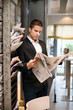 Businessman reading newspaper