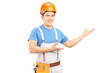 Photo: A manual worker with tool belt and helmet gesturing A manual worker with tool belt and helmet gesturing