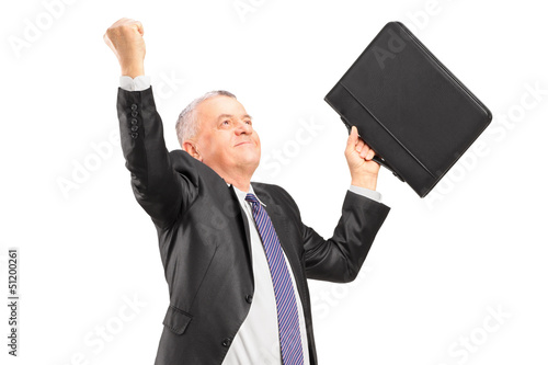 Photo: A happy mature businessman with raised hands A happy mature businessman with raised hands