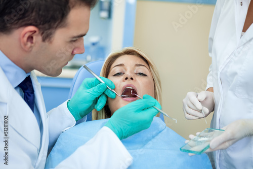 Photo: Dentist working Dentist working
