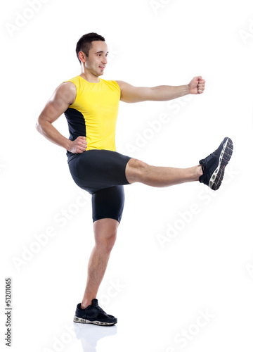 Photo: Young man practicing body attack Young man practicing body attack