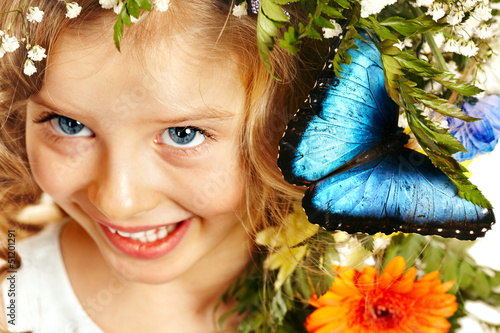 Photo: Child with butterfly and flower. Child with butterfly and flower.