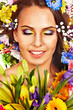 Face of woman with flower.