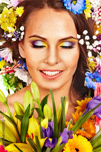Photo: Face of woman with flower. Face of woman with flower.