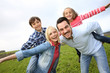 Portrait of happy family in countryside