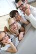 Family of four wearing eyeglasses